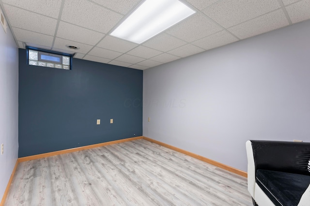 5796 Thada Ln, Columbus, OH 43229 - spare room with baseboards, a paneled ceiling, and wood finished floors