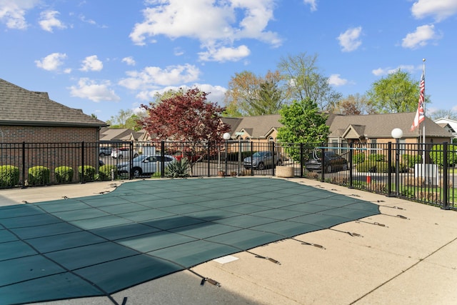 5796 Thada Ln, Columbus, OH 43229 - view of swimming pool featuring fence, a fenced in pool, and a residential view