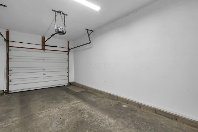 garage featuring a garage door opener