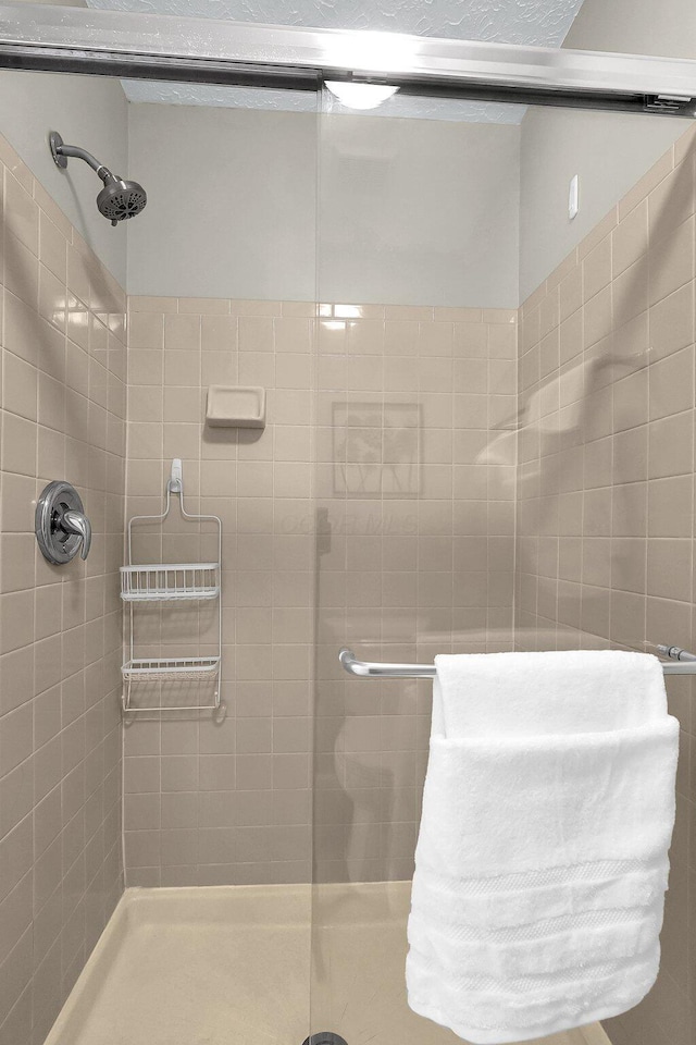 full bathroom with a stall shower