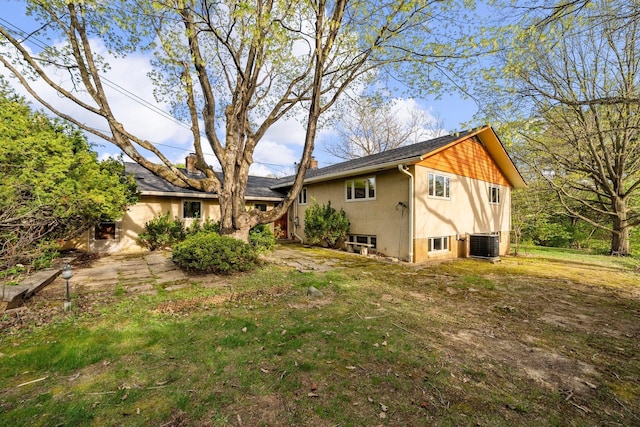back of property with central AC unit