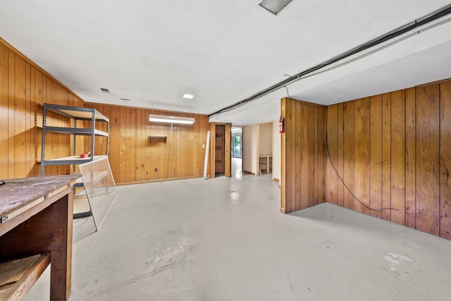 below grade area featuring wood walls