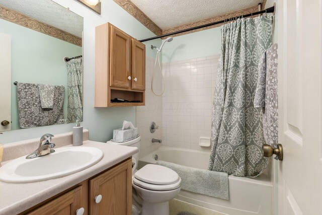 full bathroom with vanity, toilet, shower / bathtub combination with curtain, and a textured ceiling