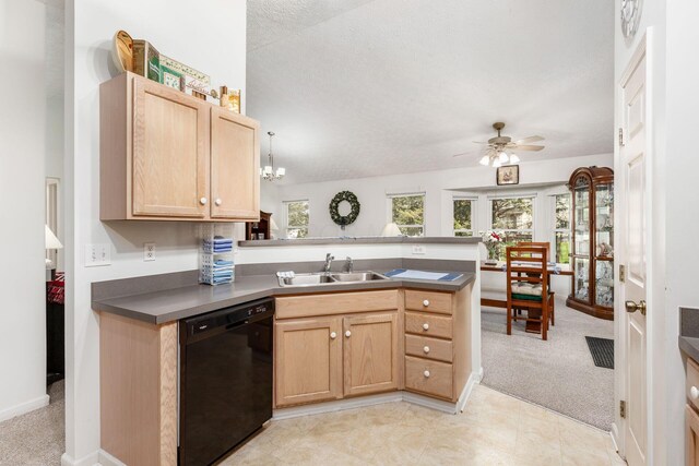 kitchen with light brown cabinetry, ceiling fan, a sink, black dishwasher, and a peninsula