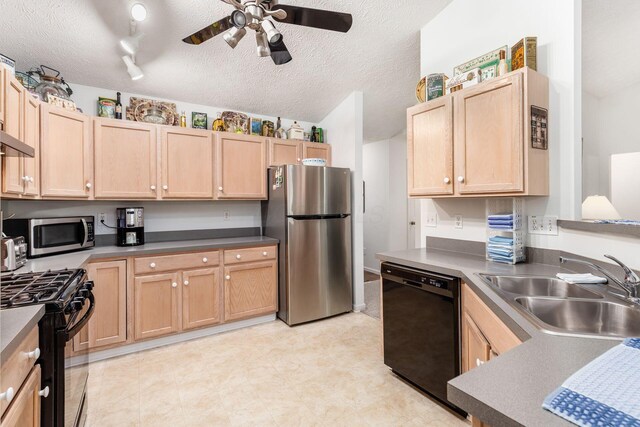 kitchen with a sink, a ceiling fan, black appliances, and light brown cabinets