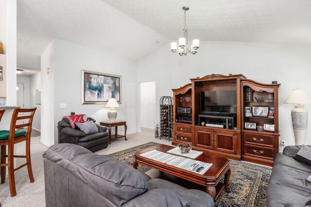 carpeted living area with baseboards, vaulted ceiling, a textured ceiling, and a notable chandelier