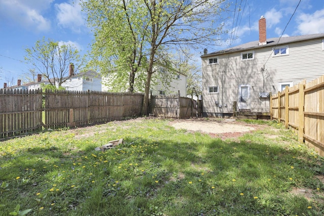 view of yard with a fenced backyard