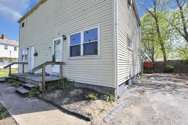 view of front of home featuring fence