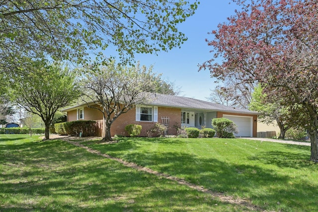 ranch-style home featuring a front lawn, a garage, and brick siding