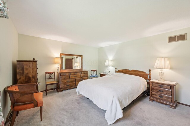 carpeted bedroom with visible vents