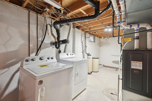 clothes washing area with heating unit, washing machine and clothes dryer, and laundry area