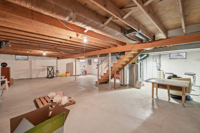 basement featuring stairs