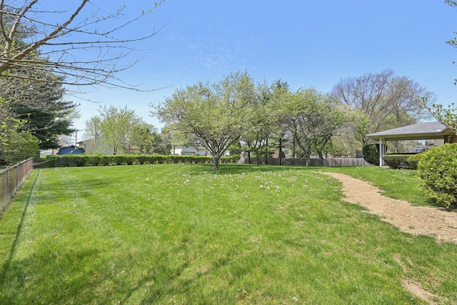 view of yard featuring fence and a gazebo