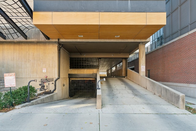view of exterior entry with a carport