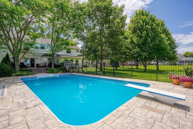 view of pool featuring a lawn, fence, a fenced in pool, and a patio area