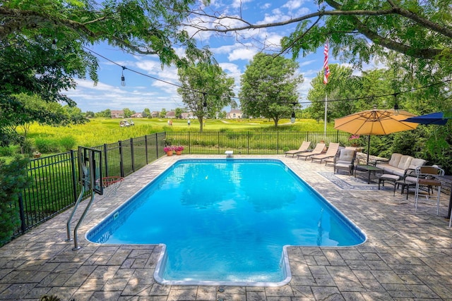 view of pool featuring fence, a patio, and a fenced in pool