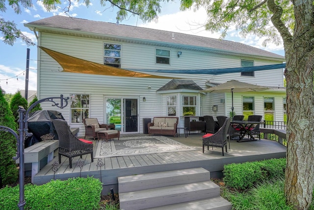 rear view of house with an outdoor hangout area and a deck