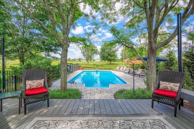 view of swimming pool featuring a patio and a fenced in pool