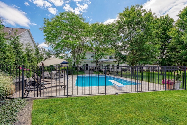 pool with a yard, a patio area, and fence