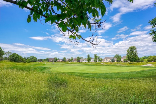 exterior space with a residential view and view of golf course