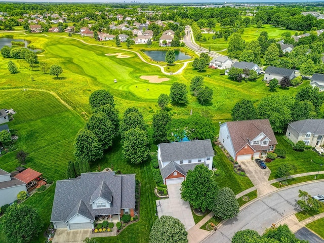 bird's eye view with a residential view, a water view, and view of golf course