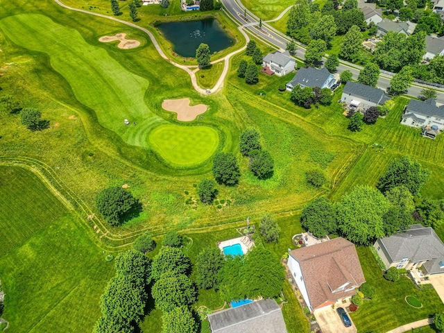 drone / aerial view with a residential view and a water view