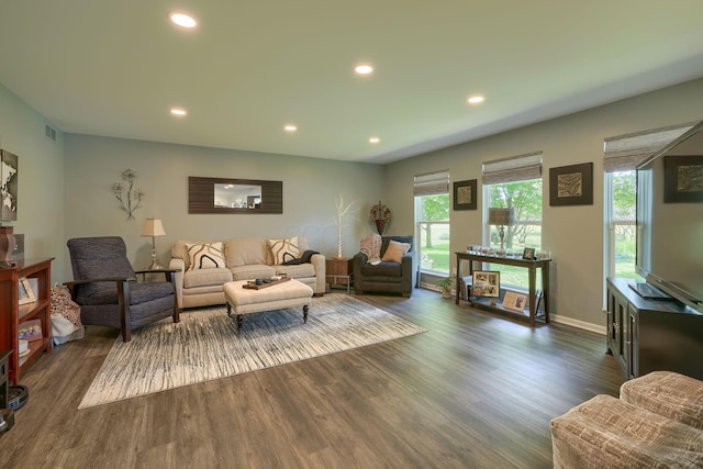 living room featuring dark wood finished floors, recessed lighting, visible vents, and baseboards