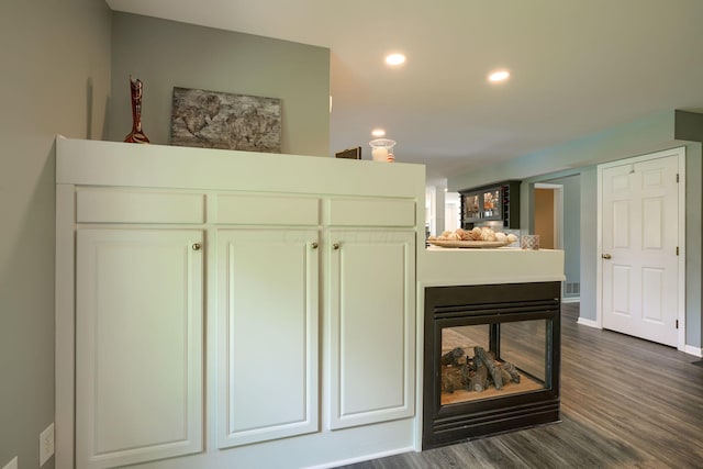 details featuring recessed lighting, wood finished floors, and baseboards