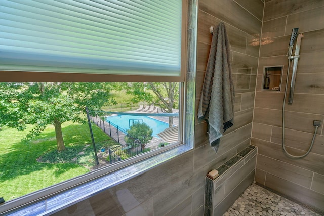 full bathroom with tiled shower