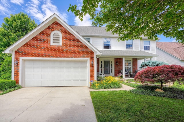 traditional home with brick siding, driveway, roof with shingles, a front lawn, and an attached garage