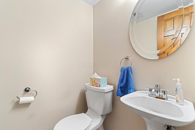 bathroom with a sink and toilet