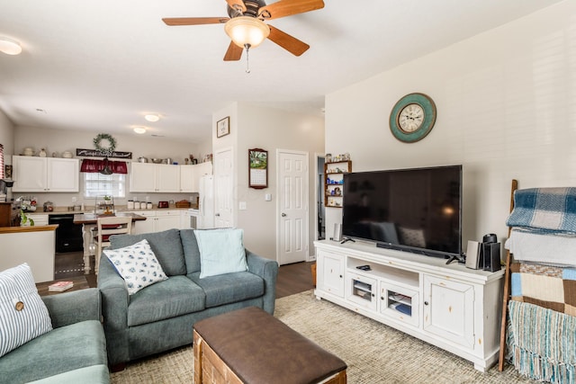 living area with ceiling fan and light wood-style floors