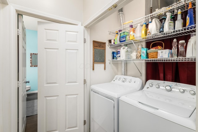 washroom featuring washer and dryer and laundry area