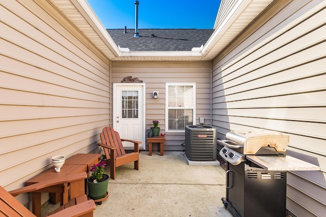 view of patio / terrace featuring a grill and cooling unit