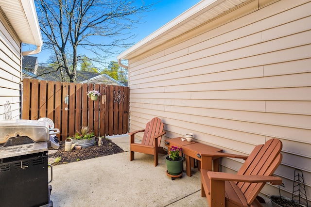 view of patio / terrace featuring area for grilling and fence
