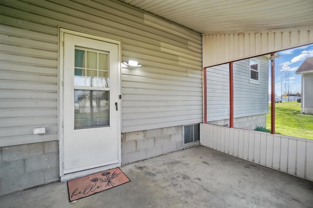 doorway to property with a patio area