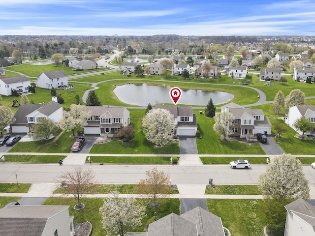 aerial view with a residential view and a water view