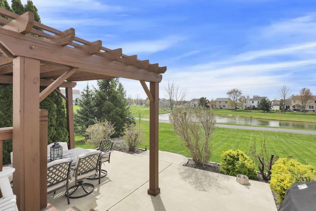 view of patio / terrace featuring a pergola, outdoor dining area, and a water view
