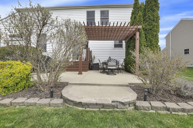 back of house with a pergola and a patio area