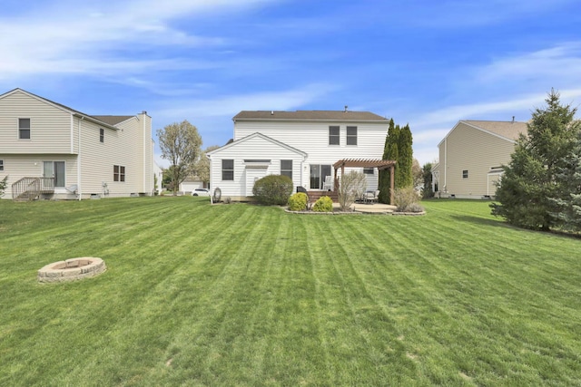 rear view of house featuring a fire pit, a pergola, a patio area, and a lawn
