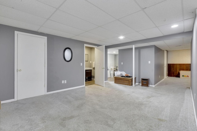 finished below grade area featuring recessed lighting, carpet, a drop ceiling, and baseboards