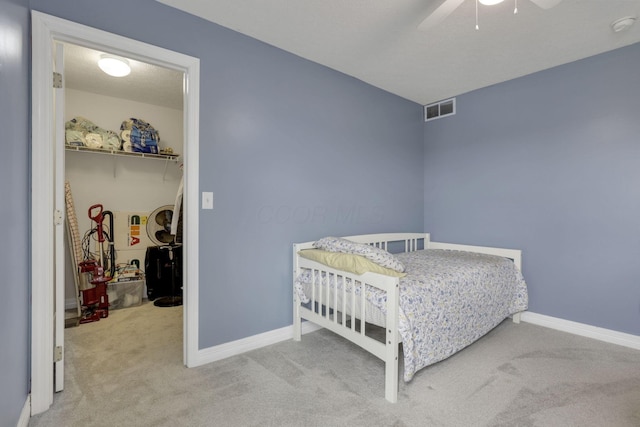 bedroom featuring baseboards, visible vents, carpet flooring, and ceiling fan