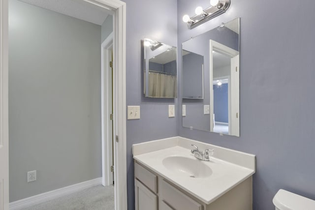 full bath with vanity and toilet