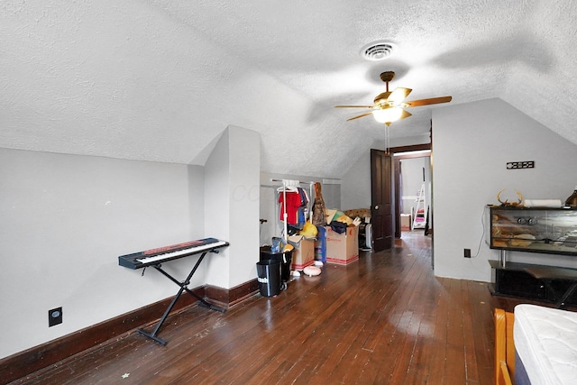 940 3rd St, Logan, OH 43138 - additional living space with a textured ceiling, vaulted ceiling, a ceiling fan, hardwood / wood-style floors, and baseboards