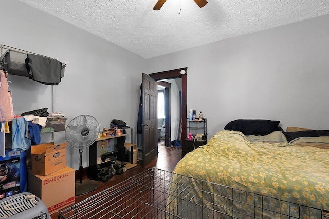 940 3rd St, Logan, OH 43138 - bedroom featuring a textured ceiling, wood finished floors, and ceiling fan