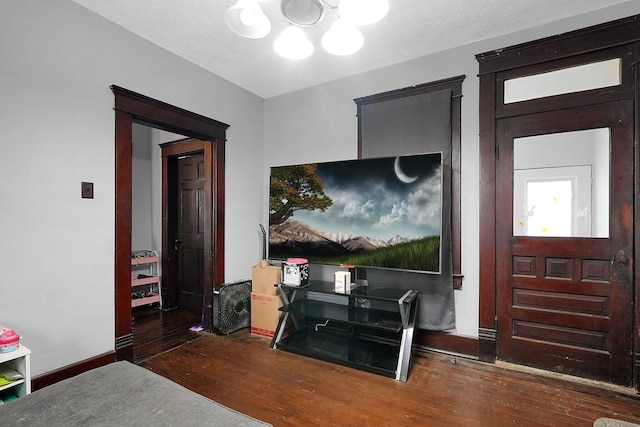 940 3rd St, Logan, OH 43138 - living room featuring hardwood / wood-style floors, a chandelier, and baseboards