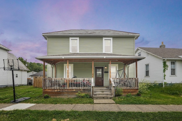 940 3rd St, Logan, OH 43138 - view of front of home featuring a porch and a front lawn