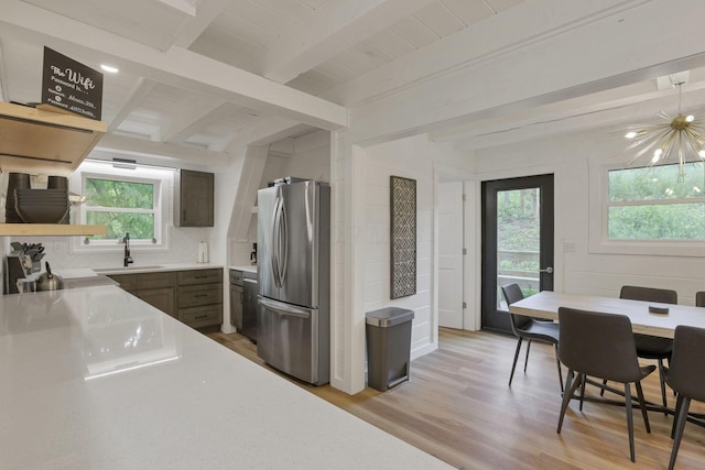 62579 Dunkle Creek Rd, Mcarthur, OH 45651 - kitchen featuring freestanding refrigerator, beamed ceiling, a healthy amount of sunlight, and a sink