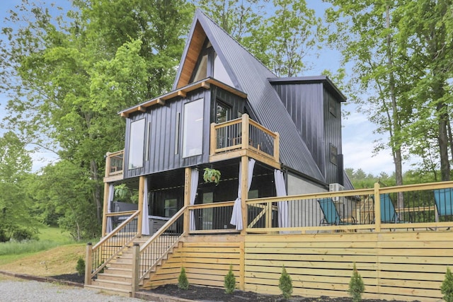 62579 Dunkle Creek Rd, Mcarthur, OH 45651 - view of front of property featuring a deck, board and batten siding, stairway, and a balcony