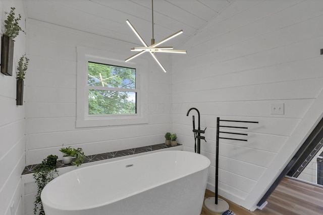 62579 Dunkle Creek Rd, Mcarthur, OH 45651 - bathroom featuring wood finished floors and a freestanding bath